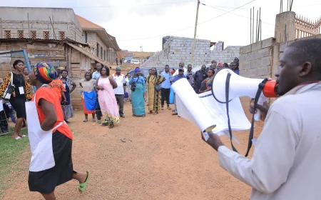PICTURES: NRM members from Nabukalu Zone, Bwaise 2 Parish in Kawempe Division attending a Village Baraza to verify and confirm LCI chairperson and Women council  Flagbearers.