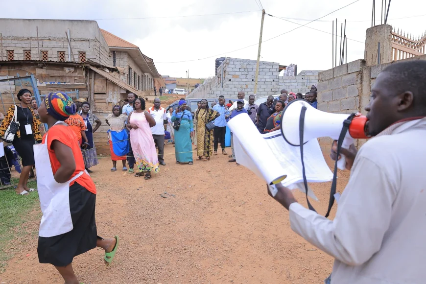 PICTURES: NRM members from Nabukalu Zone, Bwaise 2 Parish in Kawempe Division attending a Village Baraza to verify and confirm LCI chairperson and Women council  Flagbearers.